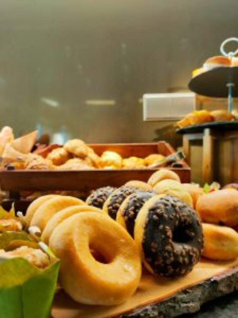 Variety of bagels displayed in a bakery setting